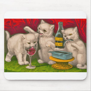 Kittens drinking and eating sardine fish mouse pad