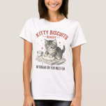 Kitty Biscuits Bakery | Funny Cat Baking Pun T-Shirt<br><div class="desc">Serve up some humor with this funny cat baking design! Welcome to the "Kitty Biscuits Bakery, " where this adorable kitten is hard at work. The design features a charming, vintage-style illustration of a cat kneading dough, complete with the hilarious pun slogan, "We Knead Em You Need Em." It's the...</div>