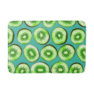 Kiwi slices on turquoise bath mat
