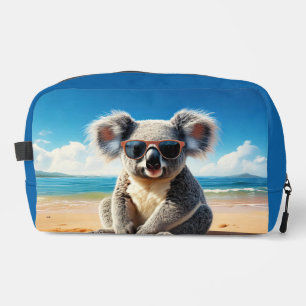 Koala on a sandy beach dopp kit