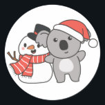 Koala With Snowman In Winter For Christmas Classic Round Sticker<br><div class="desc">Koala with snowman in winter for Christmas - a snowman for winter and Christmas. A winter greeting in the cold season for the holidays. Christmas koala with snowman.</div>