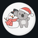 Koala With Snowman In Winter For Christmas Magnet<br><div class="desc">Koala with snowman in winter for Christmas - a snowman for winter and Christmas. A winter greeting in the cold season for the holidays. Christmas koala with snowman.</div>
