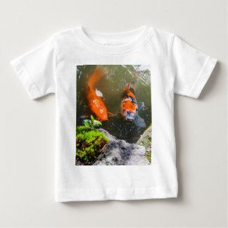 Koi fish in a pond baby T-Shirt