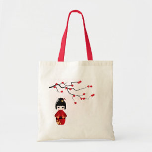Kokeshi doll under sakura branch tote bag