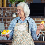 La Jefa de la Cocina | Floral Mexican Abuela Apron<br><div class="desc">Give the queen of the kitchen her crown with this charming watercolor apron, featuring soft floral scrollwork inspired by traditional Mexican design. The chest text reads “Abuela en Acción” and “La Jefa de la Cocina, ” making it the perfect blend of heartfelt and fun. Personalise it with a message from...</div>