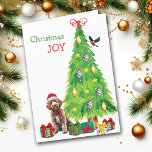 Labradoodle Dog, Bird and Christmas Tree Holiday Card<br><div class="desc">On the front of this Christmas card, a cute Labradoodle dog wears a red and white Santa Claus hat while he sits beside a Holiday tree. Brightly wrapped gift packages are scattered about, and a bullfinch is landing on the Christmas tree. The red and green text says "Christmas JOY". Inside...</div>