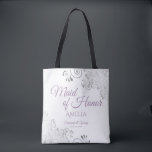 Lacy Silver & Lavender Maid of Honor White Wedding Tote Bag<br><div class="desc">This beautiful tote bag is designed as a gift, favor, or swag bag for your wedding Maid of Honor. The simple yet elegant design features ornate silver gray frills in the corners with fancy lavender purple script lettering. There is space for her name, as well as the names of the...</div>
