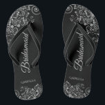 Lacy Silver on Black Elegant Bridesmaid Wedding Jandals<br><div class="desc">These elegant wedding flip flops are a great way to thank and recognise your bridesmaids, while giving their feet a rest after a long day. The beautiful design features an elegant design with ornate silver grey frills on a black background and fancy grey script lettering. The text reads Bridesmaid with...</div>