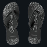 Lacy Silver on Black Elegant The Bride Wedding Jandals<br><div class="desc">Dance the night away with these beautiful wedding flip flops. Designed for the bride, they feature a simple yet elegant design with grey script lettering on a classic black background and fancy silver grey decorative curls and swirls. Beautiful way to stay fancy and appropriate while giving your feet a break...</div>
