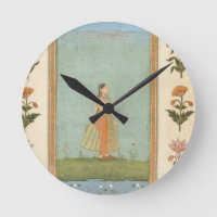 Lady holding a flower, standing by a lily pond, fr