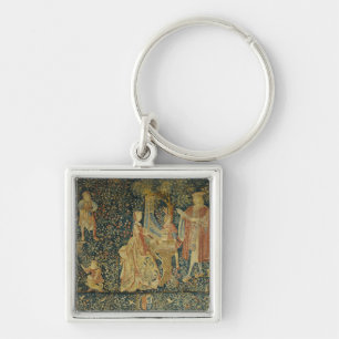 Lady playing the portative organ from key ring
