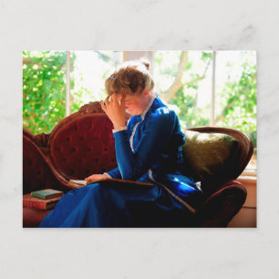 Lady reading postcard