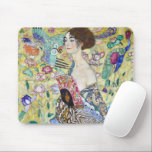 Lady with A Fan, Gustav Klimt Mouse Pad<br><div class="desc">Gustav Klimt (July 14, 1862 – February 6, 1918) was an Austrian symbolist painter and one of the most prominent members of the Vienna Secession movement. Klimt is noted for his paintings, murals, sketches, and other objets d'art. In addition to his figurative works, which include allegories and portraits, he painted...</div>