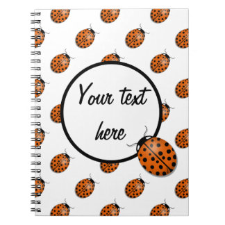 Ladybug in orange spiral notebook