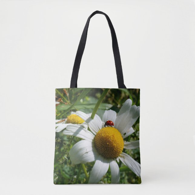 Ladybug on daisy in nature. tote bag (Front)