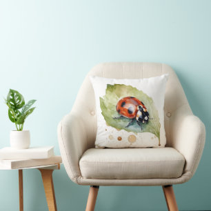 Ladybug sitting on a leaf in vibrant water colour cushion