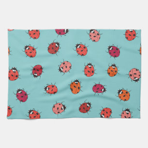 Ladybugs, blue background, charming seamless patte tea towel