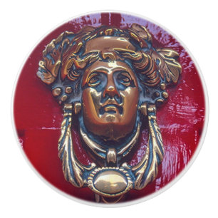 LADY'S HEAD BRASS DOOR KNOCKER (PHOTOG).ON RED CERAMIC KNOB
