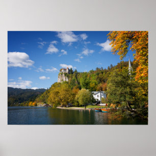 Lake Bled with trees in autumn colours in Slovenia Poster