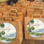 Lake Evergreen Destination Wedding Thank You Classic Round Sticker<br><div class="desc">Lake Evergreen Watercolor wedding thank you stickers with bride and groom's names and idyllic scenic landscape. Watercolor country scenery with evergreen trees and greenery, blue mountains and a still lake under a soft blue sky. The design is in shades of dusty blue and green and is lettered with modern typography....</div>