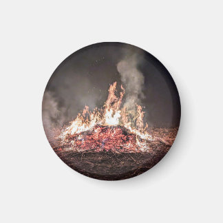 Large bonfire burning at night with high flames magnet