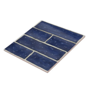 Large ceramic tile w/ dark blue faux brick design