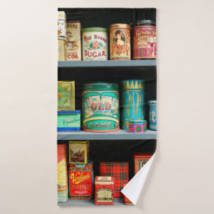 Large collection of colourful vintage cans display bath towel