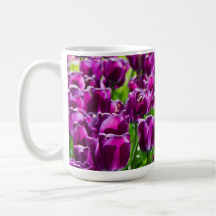 Large field of purple tulips coffee mug