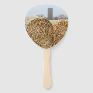 Large Round Hay Bales in a Farm Field Hand Fan