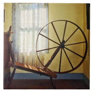 Large Spinning Wheel Near Lace Curtain Tile