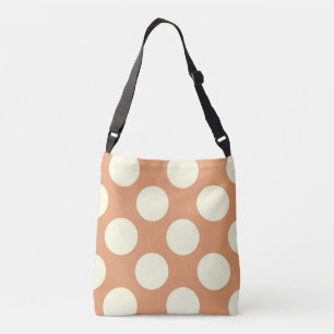 Large white polka dots design on pink crossbody bag