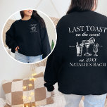 Last Toast On The Coast Beach Bachelorette Party Sweatshirt<br><div class="desc">Elevate your beach bachelorette party experience with our Last Toast On The Coast Beach Bachelorette Party Sweatshirt – a perfect blend of comfort and luxury. This custom sweatshirt goes beyond being cosy; it's a symbol of personalised style, making it an ideal choice for your last toast on the coast. Featuring...</div>