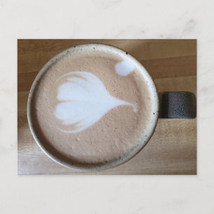 Latte art on a wooden table postcard