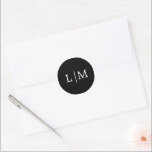 Lauren Black Monogram Elegant Wedding Classic Round Sticker<br><div class="desc">Simple wedding stickers featuring a modern yet elegant design with your two initial monogram in a white serif font over a black background. The background and font colours may be changed to any colours that you wish. A chic and stylish design that is great for a minimalist couple. These stickers...</div>