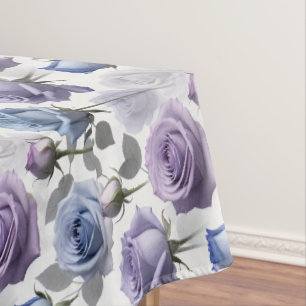 Lavender And Blue Roses Set On A Cloudy Gray Tablecloth