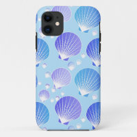 Lavender and blue seashells on pale blue