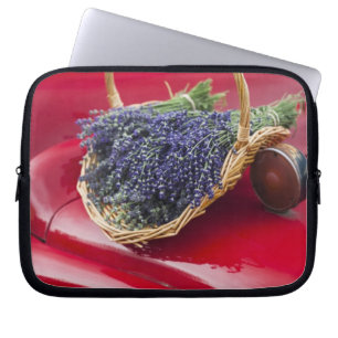Lavender bunches rest on old farm pickup truck laptop sleeve