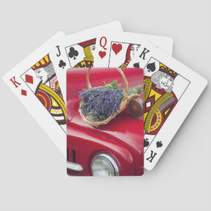 Lavender bunches rest on old farm pickup truck playing cards