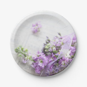 Lavender-coloured flowers on old music paper plate