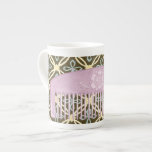 Lavender Comb on Chocolate Background Bone China Mug<br><div class="desc">A beautiful lavender comb sits on a chocolate background in this print by Megan Meagher. Floral designs peek out from behind the comb,  which also has a lovely flower on it. A great gift for fashionistas or lovers of purple!</div>