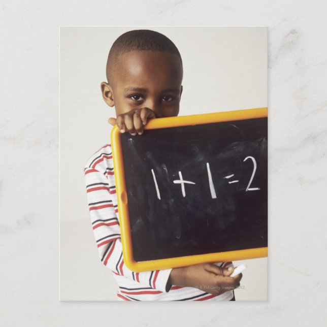 Learning arithmetic. 4-year-old boy holding a postcard (Front)