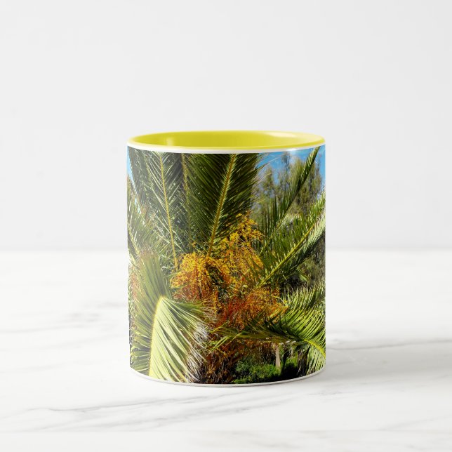 Leaves and flowers of a palm tree Two-Tone coffee mug (Center)
