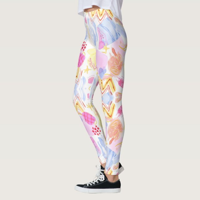 Leggings featuring a colourful abstract pattern  (Left)