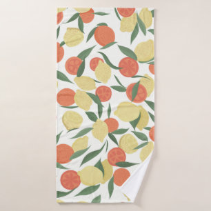Lemon and orange fruits with leaves on white backg bath towel