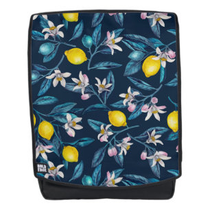 Lemon branches with blossoms and fruit on blue backpack