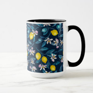 Lemon branches with blossoms and fruit on blue mug