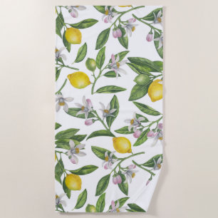 Lemon branches with blossoms and fruit on white beach towel