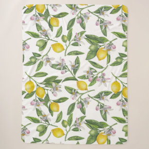 Lemon branches with blossoms and fruit on white sherpa blanket
