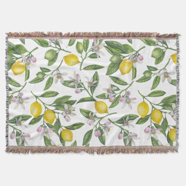 Lemon branches with blossoms and fruit on white throw blanket (Front)