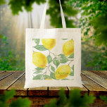 Lemon watercolored pattern white name tote bag<br><div class="desc">Juicy,  delicious modern watercolored lemon pattern in yellow,  green and white. Template for your name,  green letters. Washed out,  pale colours.</div>